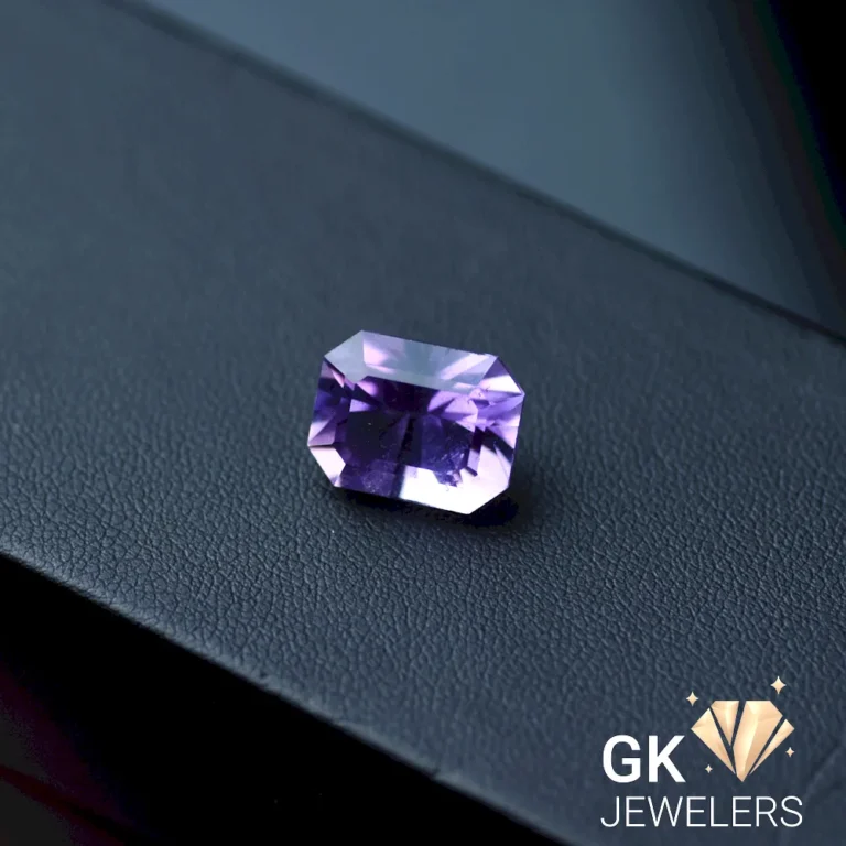 Natural amethyst gemstone on a dark surface