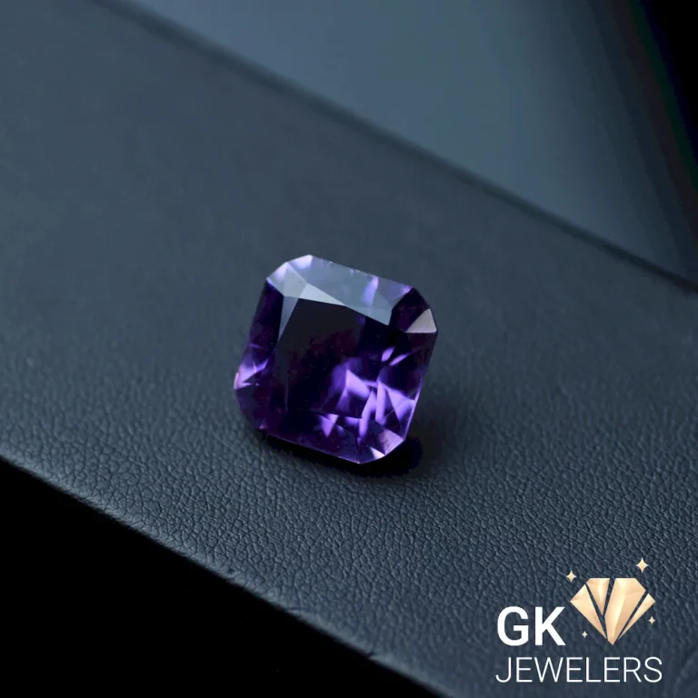 Square-cut natural amethyst gemstone on dark surface