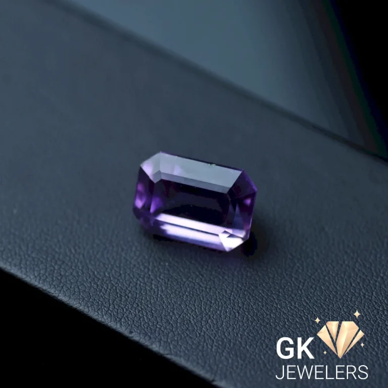 Purple laser cut amethyst gemstone on black surface
