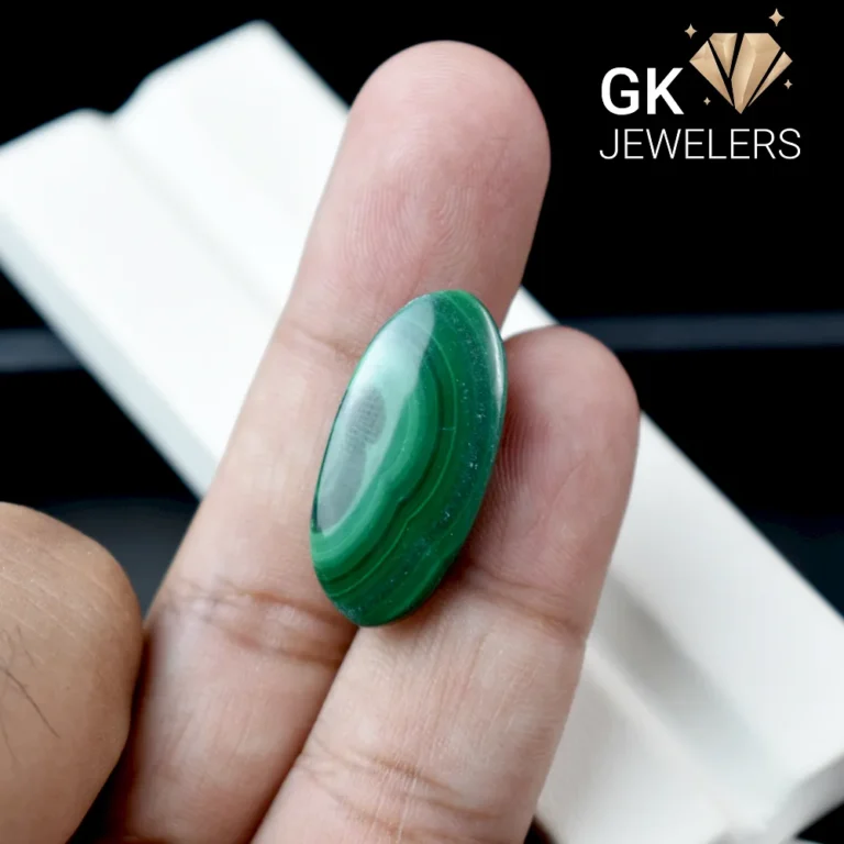 Natural malachite stone held in hand