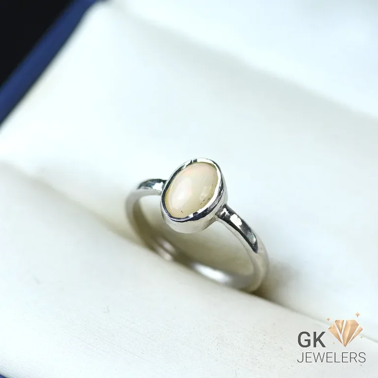 Silver ring featuring a lustrous, oval-shaped moonstone gemstone