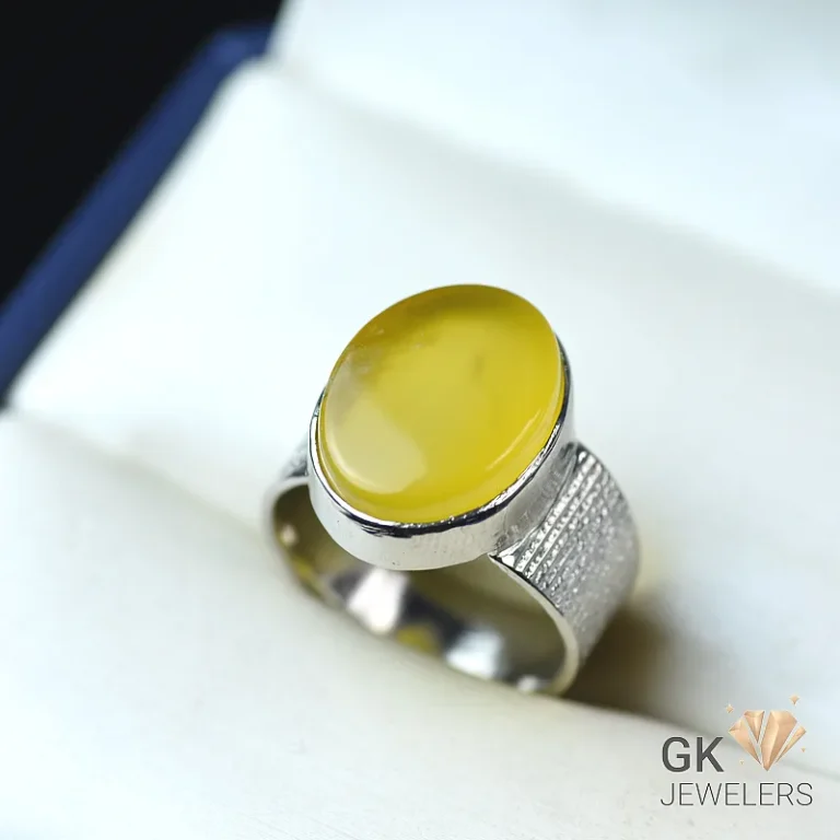 Yellow agate ring on a light background
