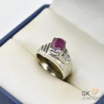 Oval-cut 3-carat ruby gemstone set in handmade silver ring, featuring vibrant red color and translucent clarity, size 20