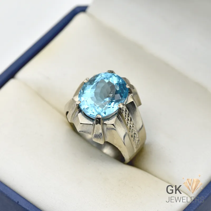 Silver ring featuring a large, round 15-carat light blue topaz gemstone from Brazil, set in a handmade sterling silver band, size 23