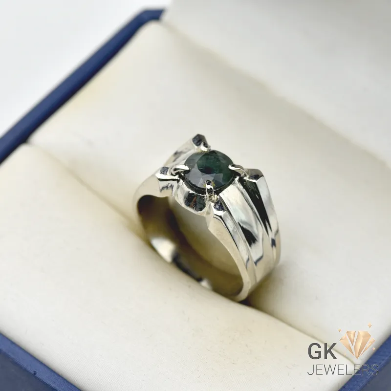 Handmade silver ring featuring a 3.5+ carat semi-transparent blue sapphire gemstone from Africa, displayed in a jewelry box