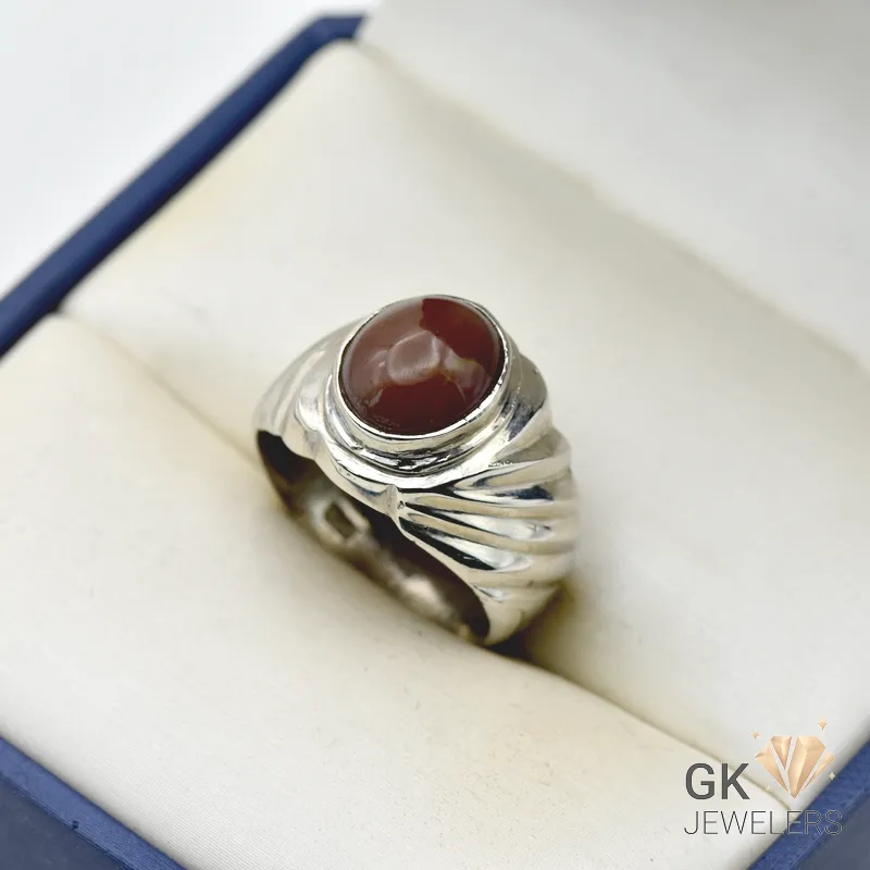 Handmade silver ring featuring a round, brown opal gemstone with translucent properties, weighing 9.62g and set in a decorative band