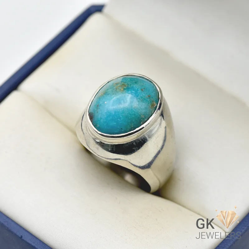 Oval turquoise gemstone set in handmade sterling silver ring, weighing 14.60g with a ring size of 28