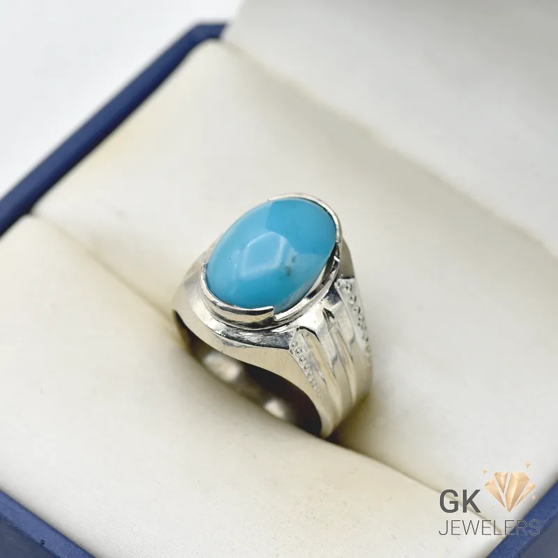Silver ring featuring a 6+ carat natural turquoise feroza stone with vibrant blue color and matrix patterns, set in a handmade artisan silver setting.