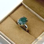 Oval-cut Zambian emerald gemstone set in handmade sterling silver ring, size 14