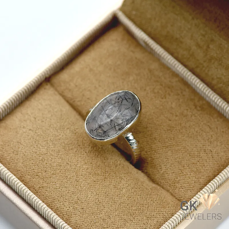 Silver ring featuring oval-cut black quartz (Muh-e-Najaf) gemstone with semi-transparent qualities, handmade setting, and premium silver construction