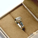 Handmade silver ring featuring a transparent round-cut natural citrine gemstone from Africa, showcasing vibrant yellow color