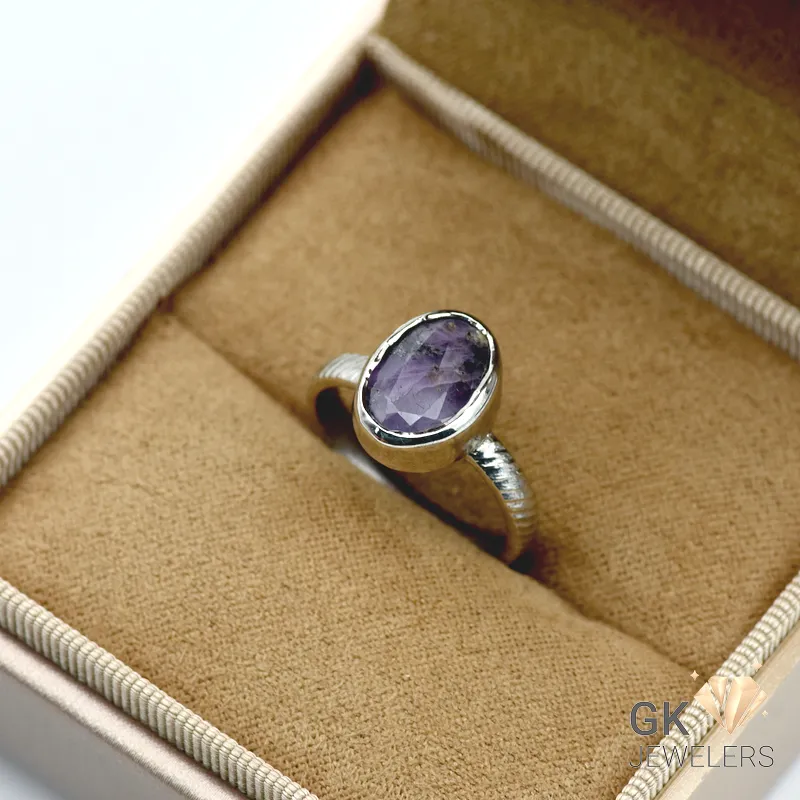 Purple oval-cut sapphire gemstone set in handmade 925 silver ring from Afghanistan