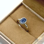 Oval-cut black sapphire gemstone set in handmade sterling silver ring, originating from Sri Lanka