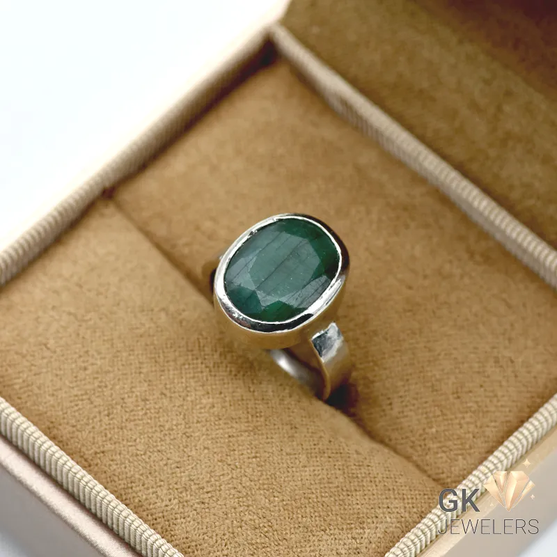 Oval-cut natural emerald gemstone set in 925 sterling silver ring with handmade setting, weighing 4.88g, size 14