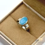 Handmade silver ring featuring an oval-cut natural turquoise gemstone from Iran, set in sterling silver with opaque blue color