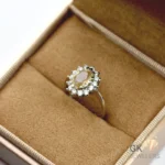 Oval-cut natural citrine gemstone surrounded by diamonds in a 925 silver handmade ring setting