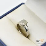 Oval white sapphire gemstone set in a handmade silver ring with semi-transparent clarity, originating from Sri Lanka