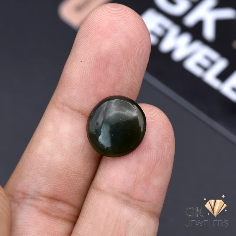 Dark green translucent jade gemstone, round cut, held between fingers, showcasing natural beauty and Russian origin
