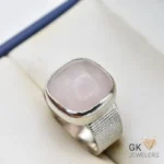 Silver ring featuring a square-cut rose quartz gemstone with pink hue and translucent quality, handmade setting, size 21
