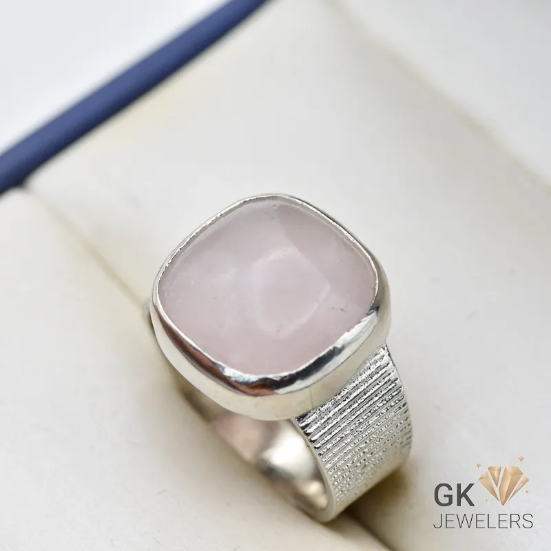 Silver ring featuring a square-cut rose quartz gemstone with pink hue and translucent quality, handmade setting, size 21