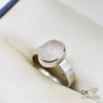Handmade silver ring featuring a round, translucent African rose quartz gemstone in a simple bezel setting, weighing 4.46g