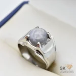 Silver ring featuring a round blue star sapphire gemstone with asterism, handmade setting, size 21