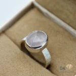 Oval rose quartz gemstone set in a handmade silver ring with textured band, size 18.5, weighing 4.70g