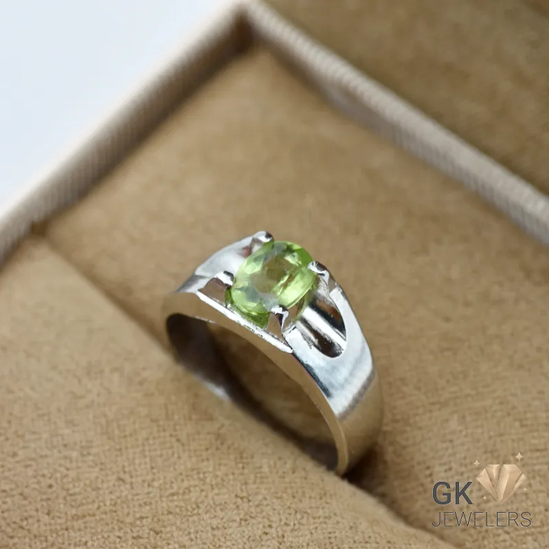 Oval-cut transparent peridot gemstone set in handmade sterling silver ring, size 15, originating from Afghanistan