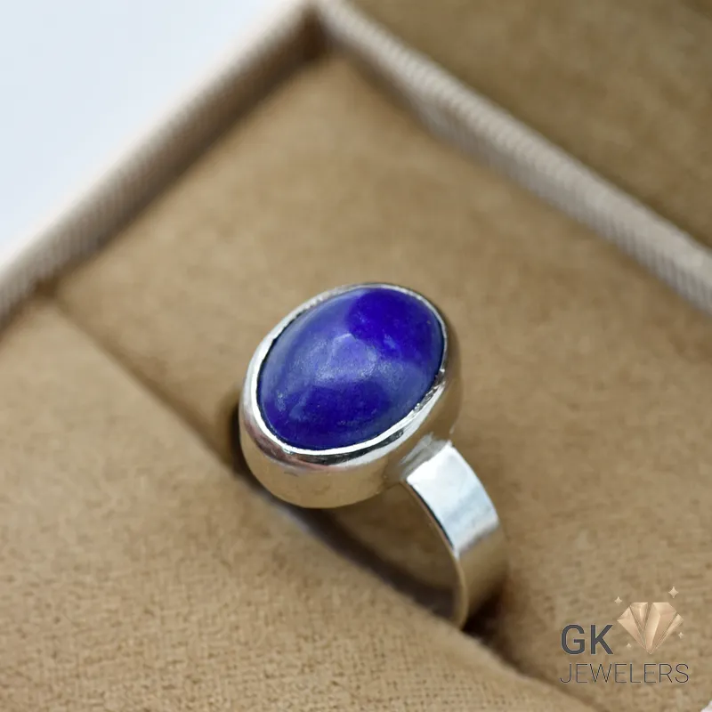 Oval-shaped natural Lapis Lazuli gemstone set in a handmade silver ring, size 16, originating from Afghanistan