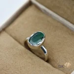 Silver ring with oval-cut Zambian emerald gemstone, handmade setting, translucent green color, size 9