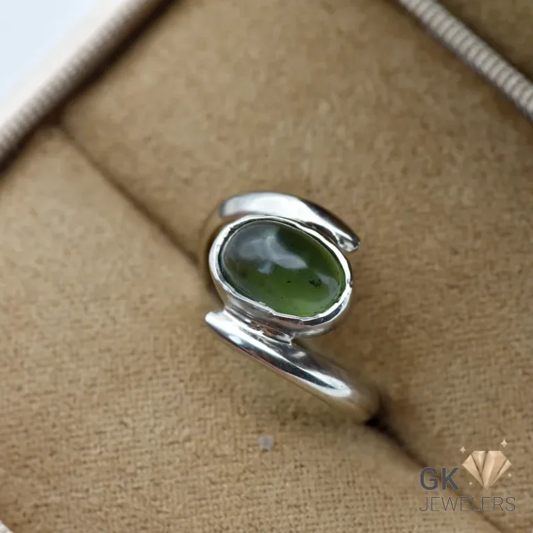 Oval-cut natural Russian jade gemstone set in handmade silver ring, size 14, translucent green color