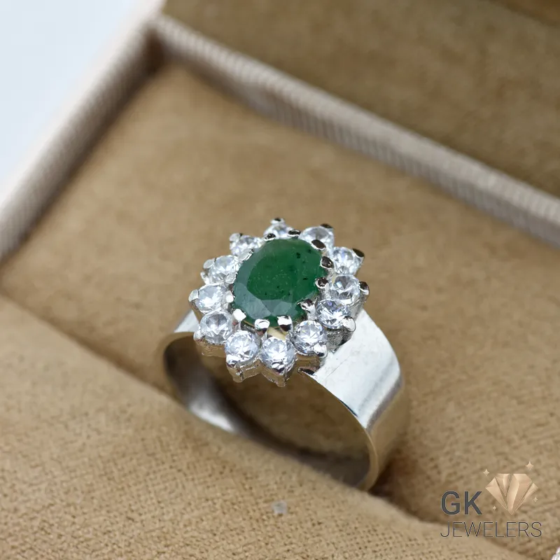 Oval-cut Zambian emerald ring in sterling silver with diamond halo, handmade setting, translucent green color