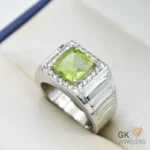 Silver ring featuring a transparent square-cut green peridot gemstone surrounded by small diamonds, handmade in Afghanistan