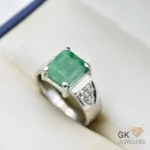 Silver ring featuring a large, emerald-cut green zamarud stone with diamond accents, set in a handmade silver band, size 19