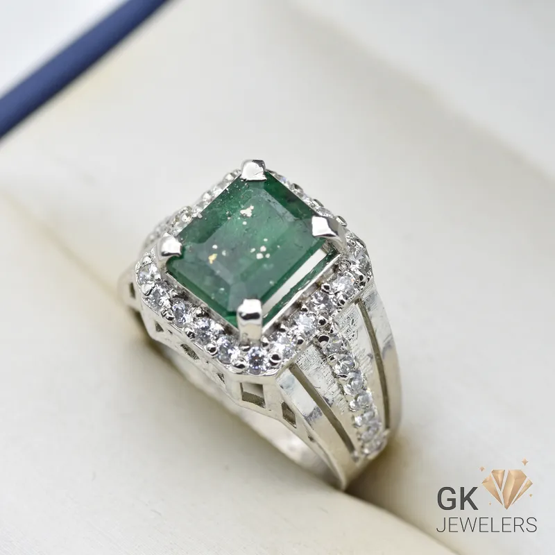 Silver ring featuring a square-cut emerald gemstone surrounded by diamonds, set in a handmade sterling silver band, size 22