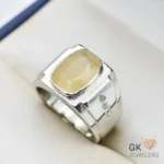 Silver ring featuring a large, cushion-cut yellow sapphire gemstone with semi-transparent color and handmade setting, size 21