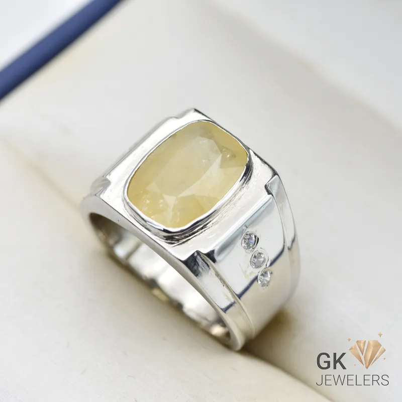 Silver ring featuring a large, cushion-cut yellow sapphire gemstone with semi-transparent color and handmade setting, size 21
