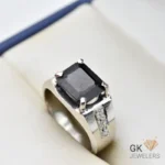 Black tourmaline gemstone set in handmade silver ring with emerald cut and geometric accents, size 20