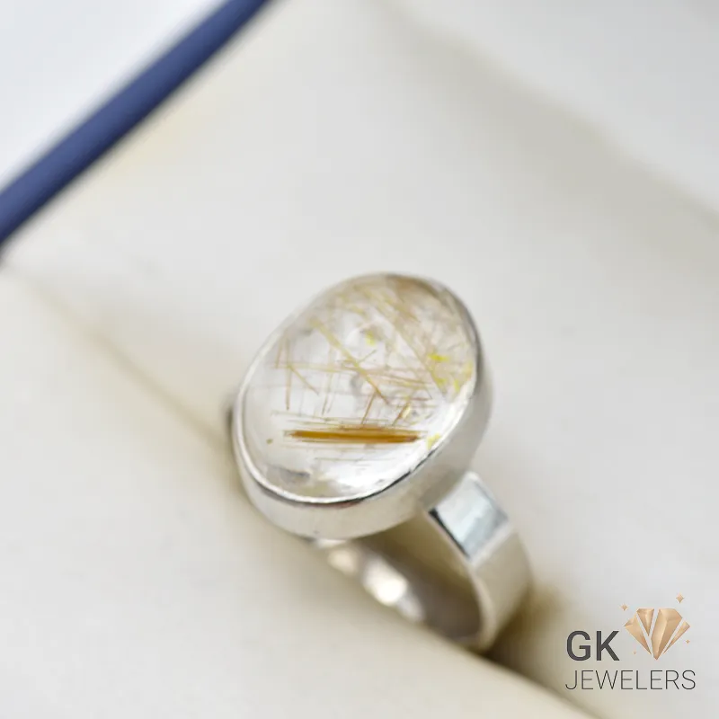 Handmade silver ring featuring an oval-cut natural golden Quartz (Muh-e-Najaf) gemstone with golden inclusions and transparent clarity
