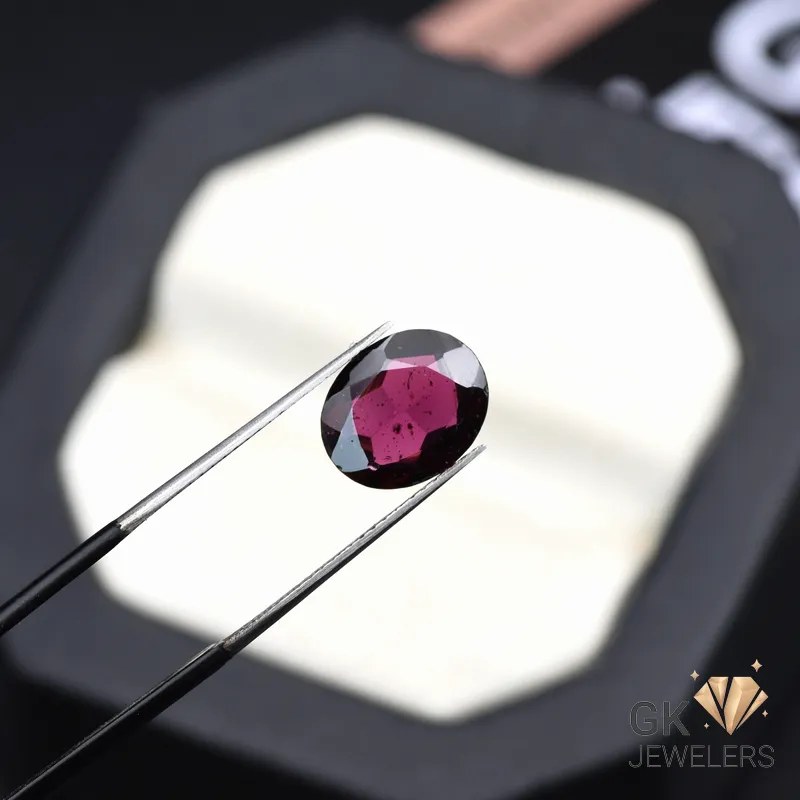 natural almandine garnet 3.15ct purplish red oval stone, GK Jewelers Pakistan authentic gemstone photo