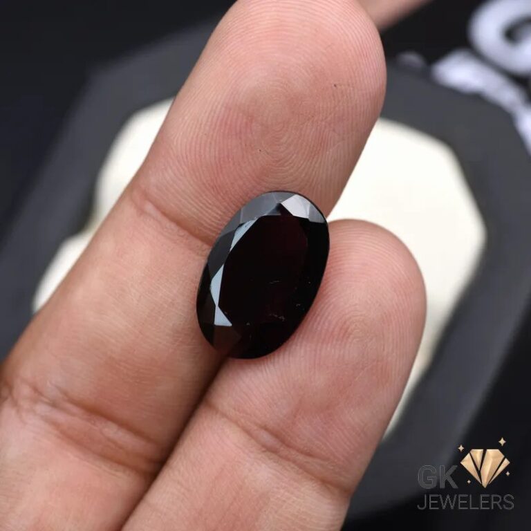 natural almandine garnet 7.60ct purplish red oval stone, GK Jewelers Pakistan authentic gemstone photo