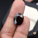 natural hessonite garnet 13.06ct reddish orange oval stone, GK Jewelers Pakistan authentic gemstone photo
