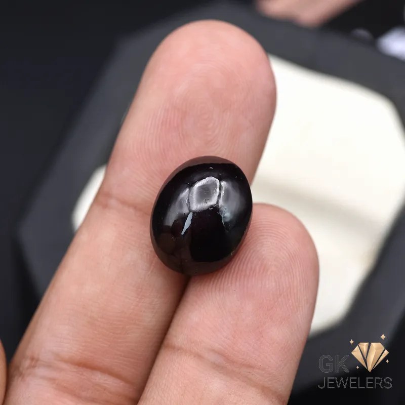 natural star garnet 19.46ct reddish purple oval stone, GK Jewelers Pakistan authentic gemstone photo
