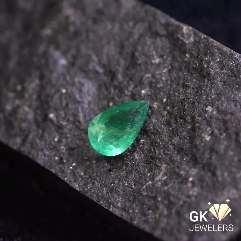 natural emerald 0.55ct green pear stone, GK Jewelers Pakistan authentic gemstone photo