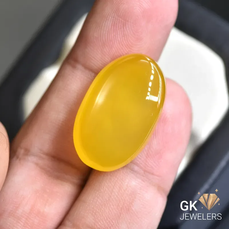 natural agate 31.54ct yellow oval stone, GK Jewelers Pakistan authentic gemstone photo