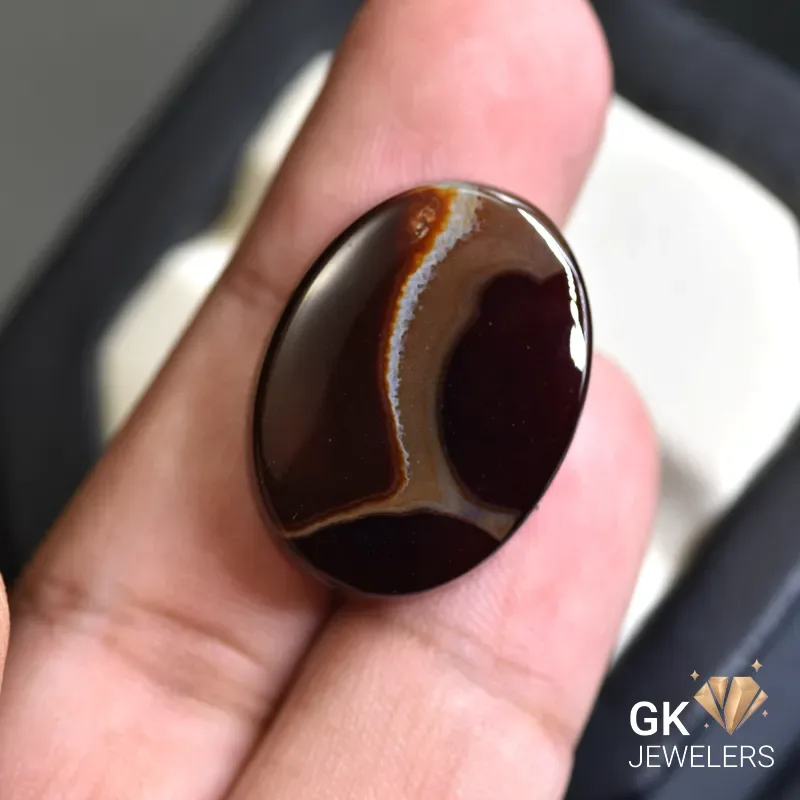 natural agate 31.81ct brown oval stone - GK Jewelers Pakistan authentic gemstone photo