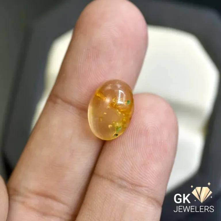 natural amber 2.24ct yellow cabochon stone - GK Jewelers Pakistan authentic gemstone photo