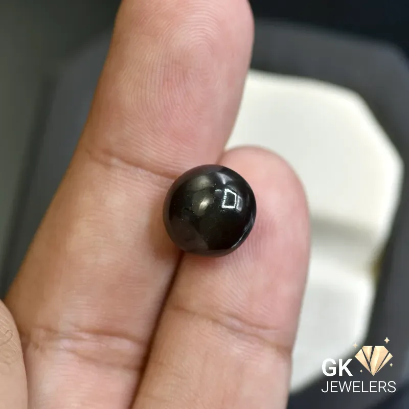 natural cat eye 8.21ct black cabochon stone, GK Jewelers Pakistan authentic gemstone photo