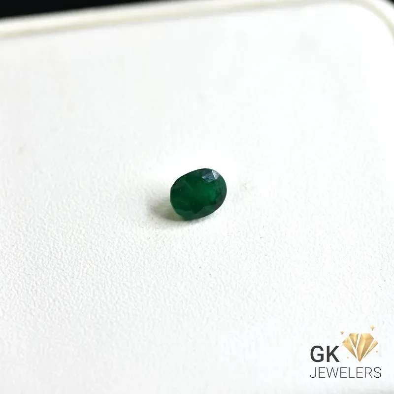 natural emerald 0.73ct green cushion stone, GK Jewelers Pakistan authentic gemstone photo