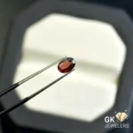created garnet 1.09ct red oval stone - GK Jewelers Pakistan authentic gemstone photo